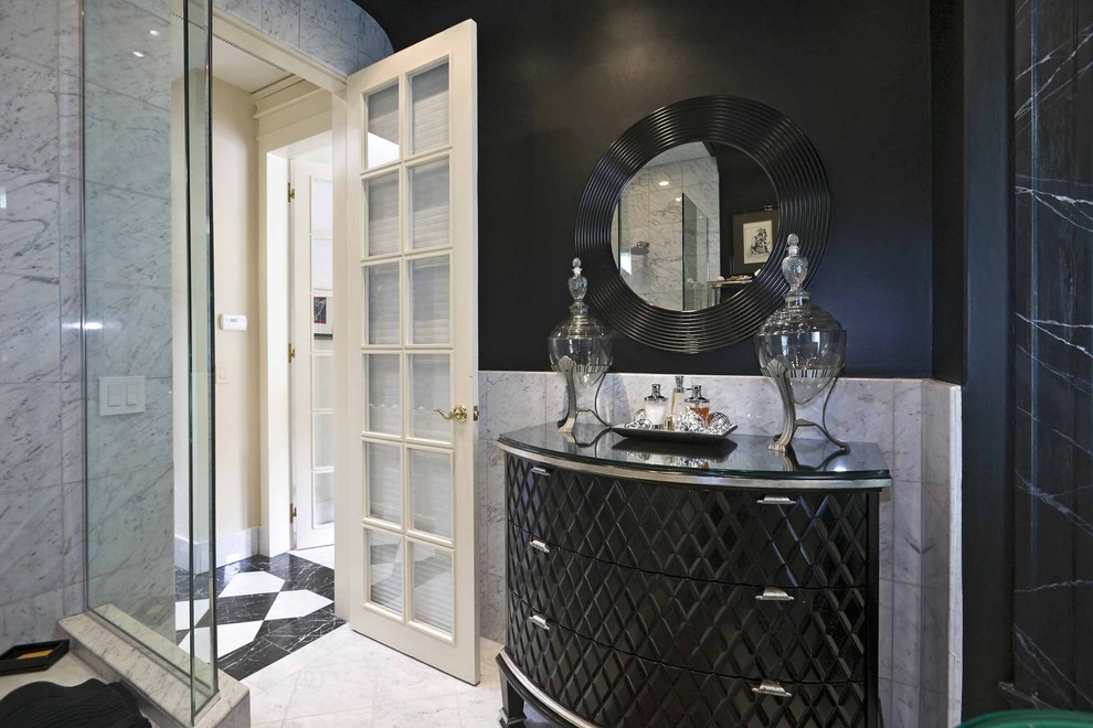 This is an example of a traditional bathroom in Other with black cabinets, white tile and black walls.