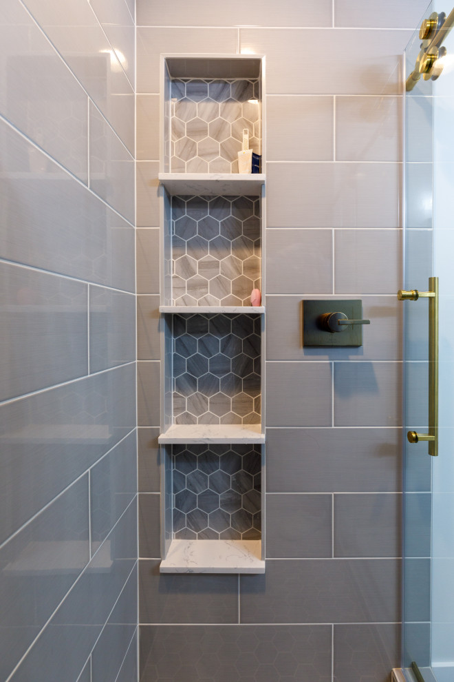 Mid-sized transitional 3/4 gray tile and ceramic tile vinyl floor, brown floor and single-sink bathroom photo in Minneapolis with recessed-panel cabinets, blue cabinets, a two-piece toilet, white walls, an undermount sink, quartz countertops, white countertops and a built-in vanity