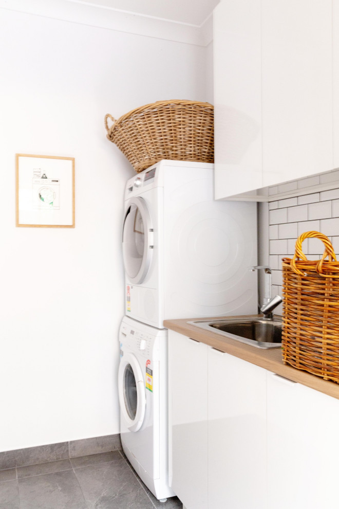 This is an example of a transitional laundry room in Melbourne.