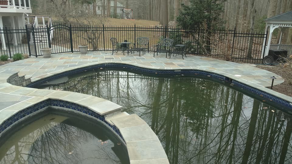 Inspiration for a huge transitional backyard stone and kidney-shaped natural pool remodel