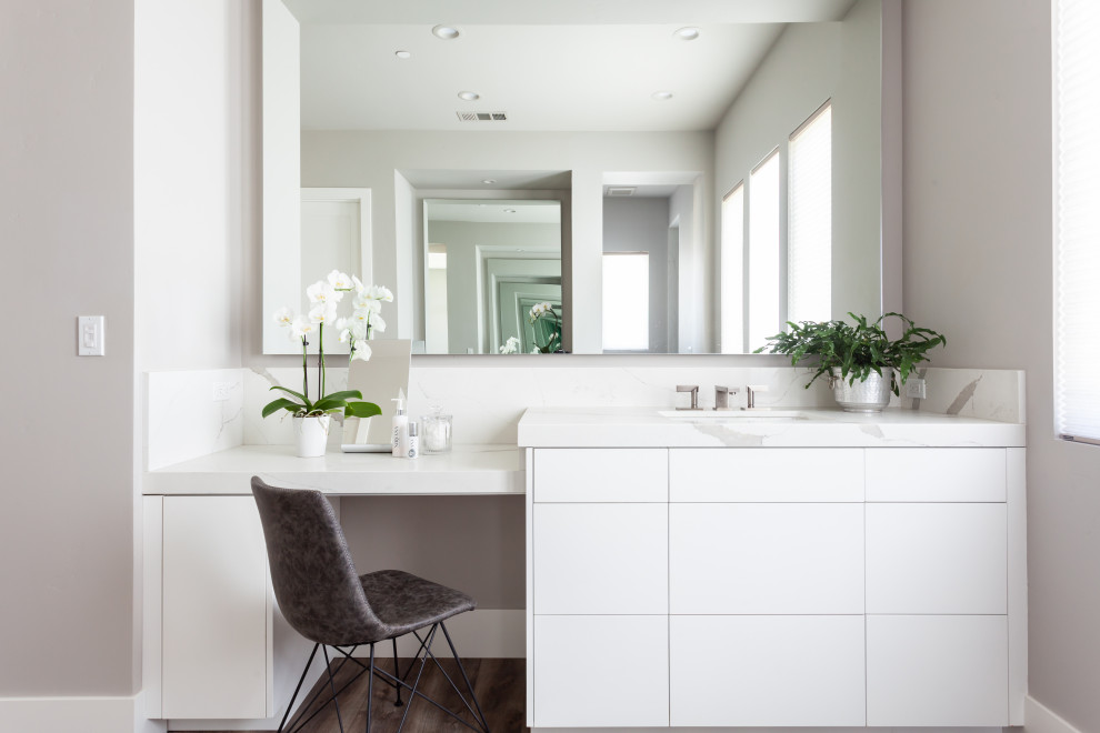 Photo of a large contemporary master bathroom in Sacramento with flat-panel cabinets, white cabinets, a double shower, white tile, stone slab, grey walls, vinyl floors, an undermount sink, engineered quartz benchtops, brown floor and white benchtops.