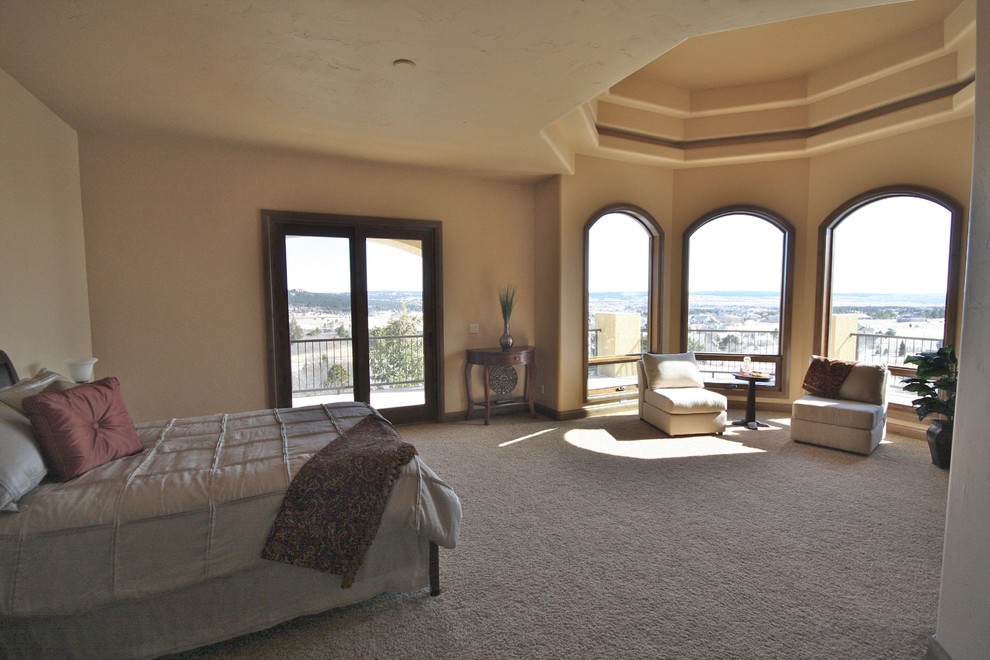 Bedroom - large transitional master bedroom idea in Denver with beige walls