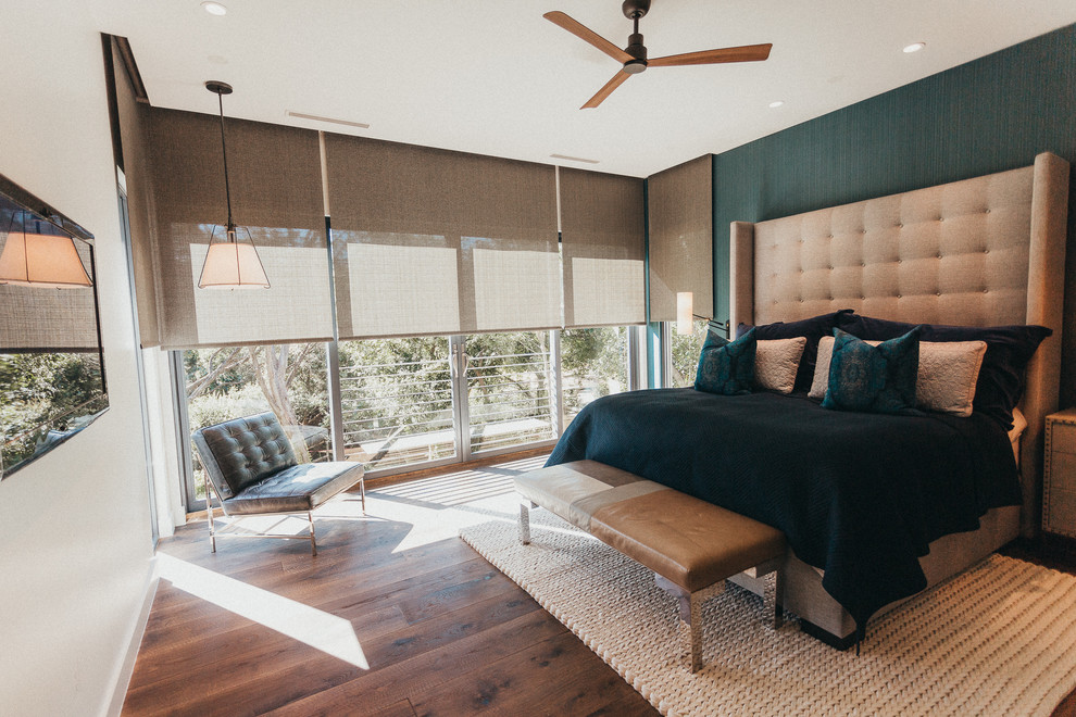 Inspiration for a mid-sized contemporary master bedroom in Austin with multi-coloured walls, dark hardwood floors, no fireplace and brown floor.