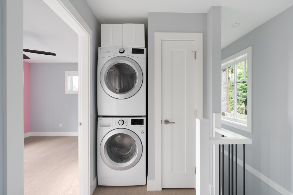 Design ideas for a transitional laundry room in Vancouver.