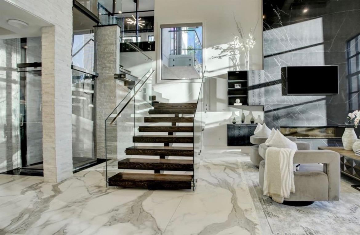 Beautiful Glass walls surround this Floating Staircase