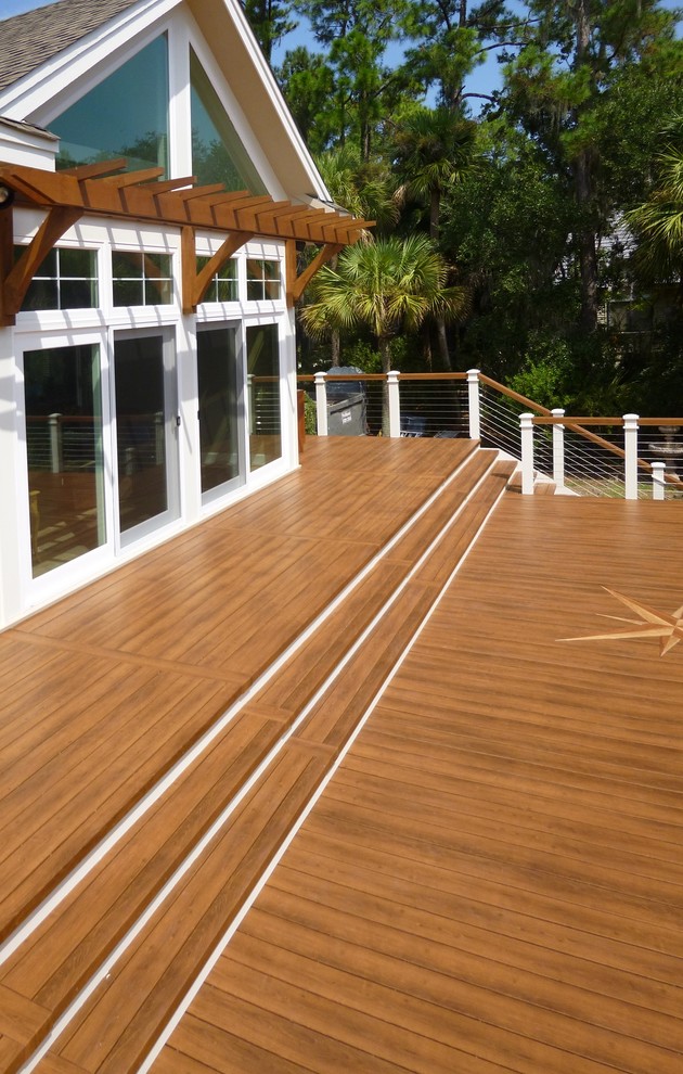 This is an example of an expansive contemporary backyard deck in Minneapolis with no cover.
