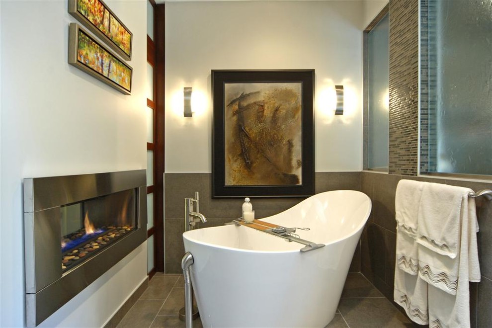 Inspiration for a modern bathroom in Calgary with a freestanding tub.