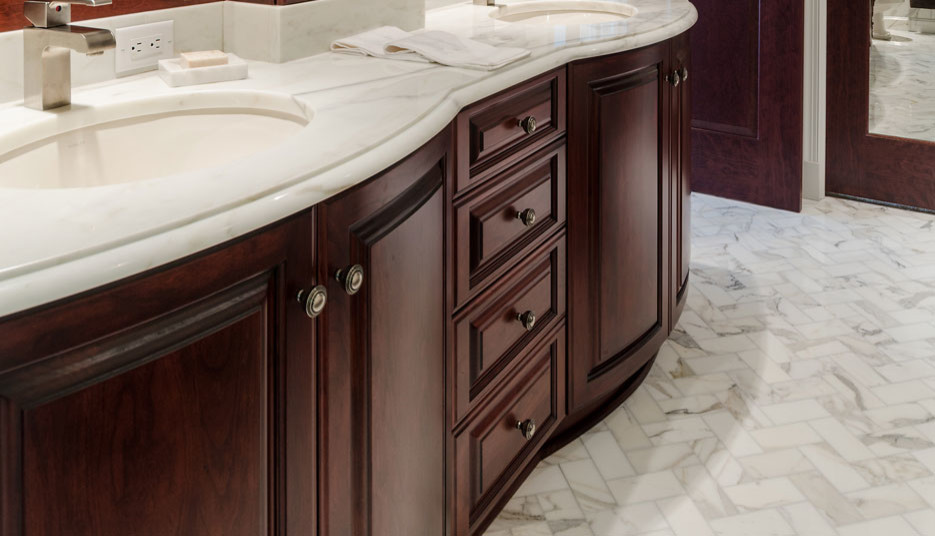 Design ideas for a mid-sized transitional master bathroom in Other with dark wood cabinets, a freestanding tub, white tile, marble, marble benchtops and a hinged shower door.