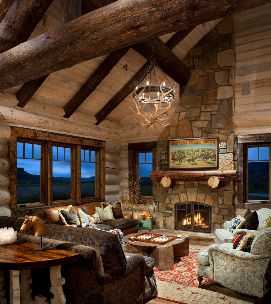 This is an example of a mid-sized country formal living room in Denver with a standard fireplace and a stone fireplace surround.