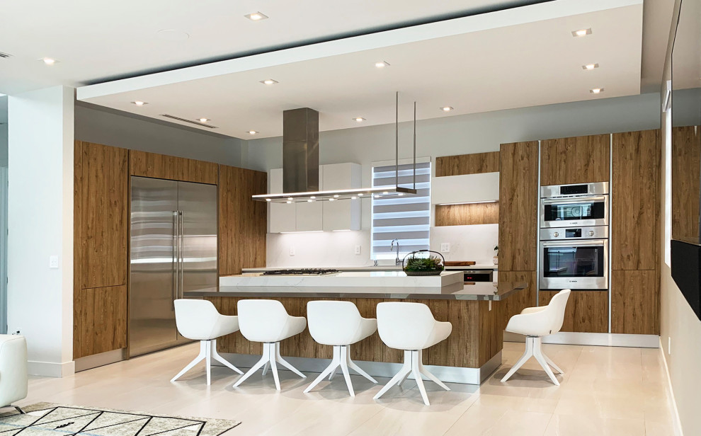 This is an example of a medium sized modern kitchen in Miami.