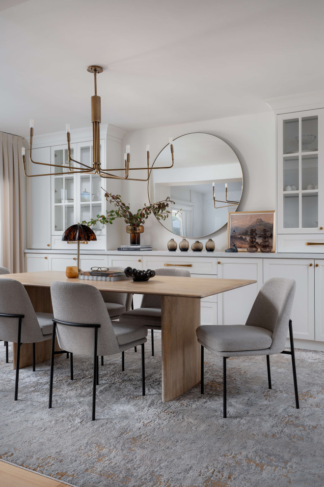 Kitchen/dining room combo - mid-sized transitional medium tone wood floor and beige floor kitchen/dining room combo idea in Toronto with white walls