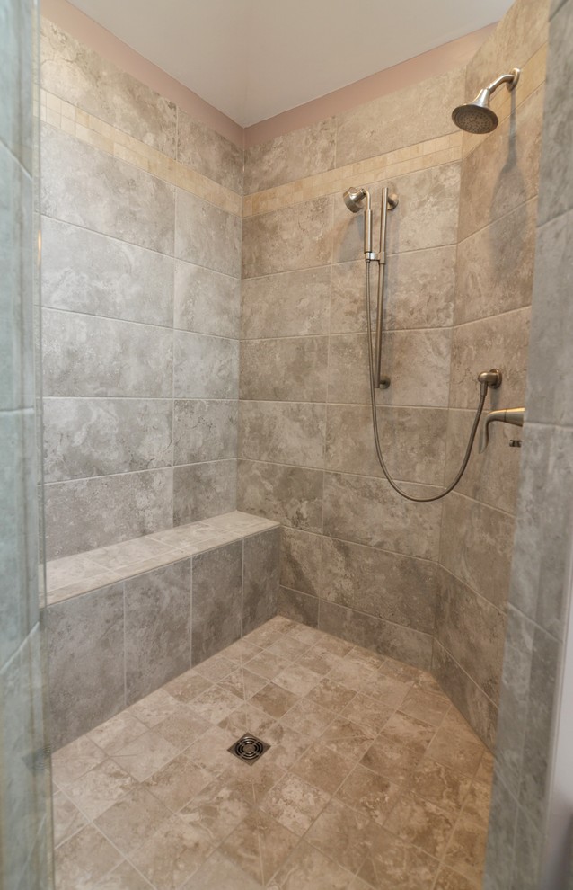 This is an example of a mid-sized transitional master bathroom in Other with recessed-panel cabinets, dark wood cabinets, a drop-in tub, a corner shower, a two-piece toilet, beige tile, porcelain tile, purple walls, porcelain floors, an undermount sink and engineered quartz benchtops.