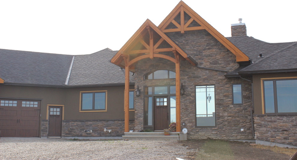 Example of a mountain style home design design in Calgary
