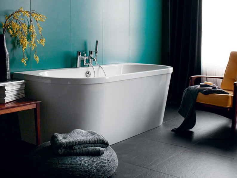 Photo of a mid-sized contemporary kids bathroom in Cambridgeshire with flat-panel cabinets, white cabinets, a drop-in tub, a curbless shower, a one-piece toilet, gray tile, porcelain tile, grey walls, marble floors and a pedestal sink.