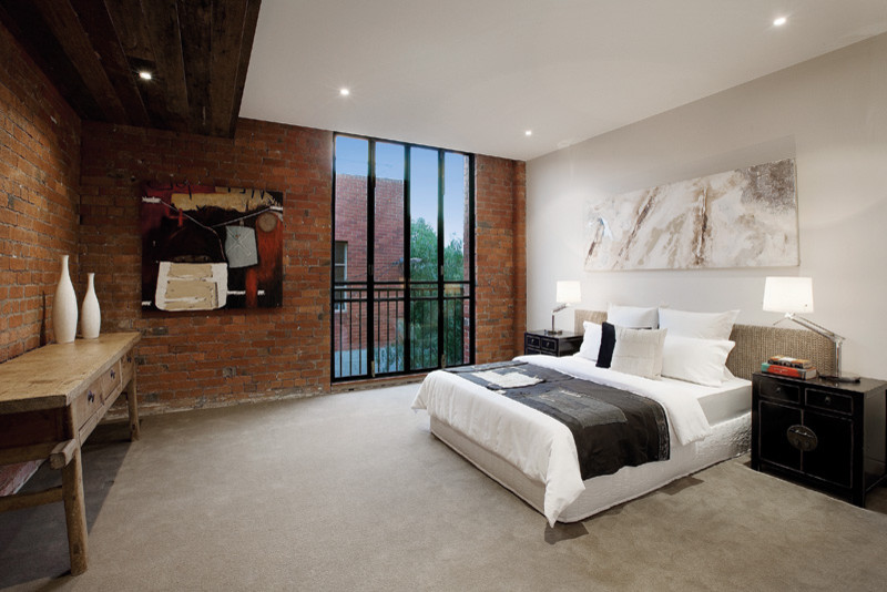 Design ideas for an industrial bedroom in Melbourne with white walls and carpet.