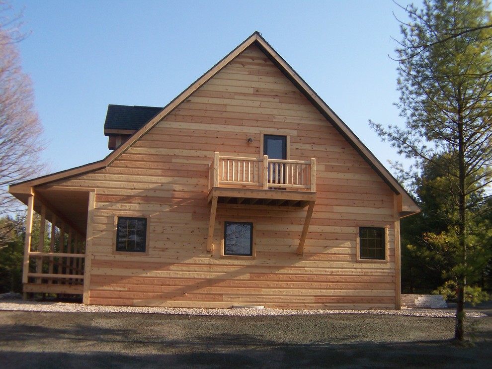 Mid-sized rustic beige two-story wood gable roof idea with a shingle roof
