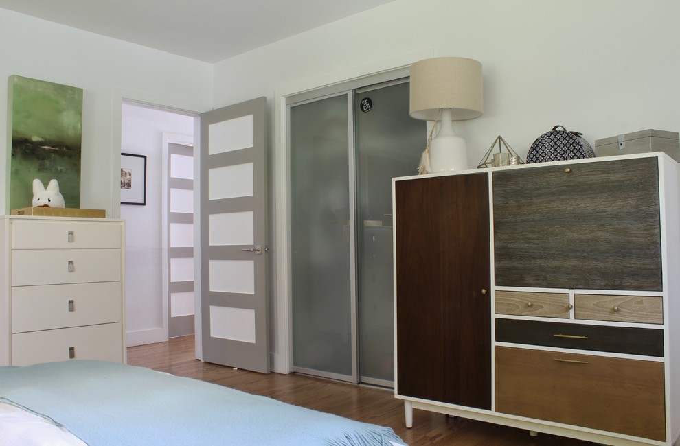 This is an example of a midcentury bedroom in San Diego.
