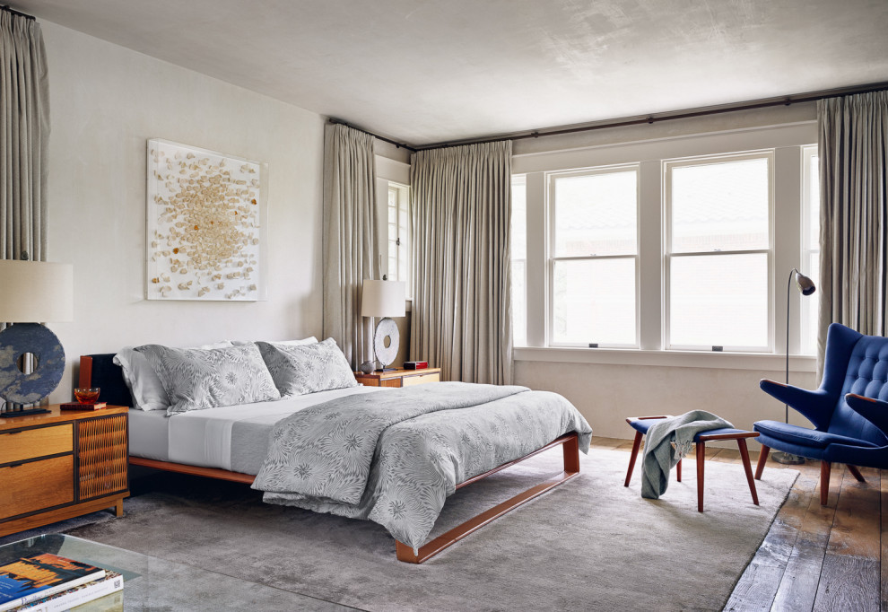 Houston Historic - Example of a large trendy master dark wood floor and brown floor bedroom design in Houston with beige walls