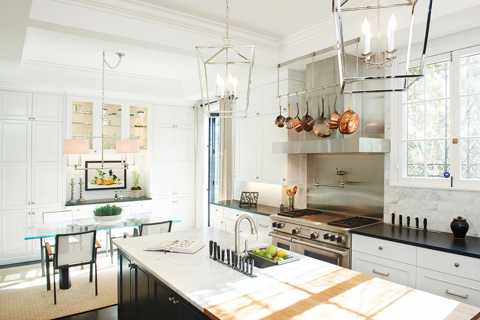 Eat-in kitchen - large transitional dark wood floor eat-in kitchen idea in Los Angeles with an undermount sink, recessed-panel cabinets, white cabinets, granite countertops, white backsplash, stone tile backsplash, stainless steel appliances and an island