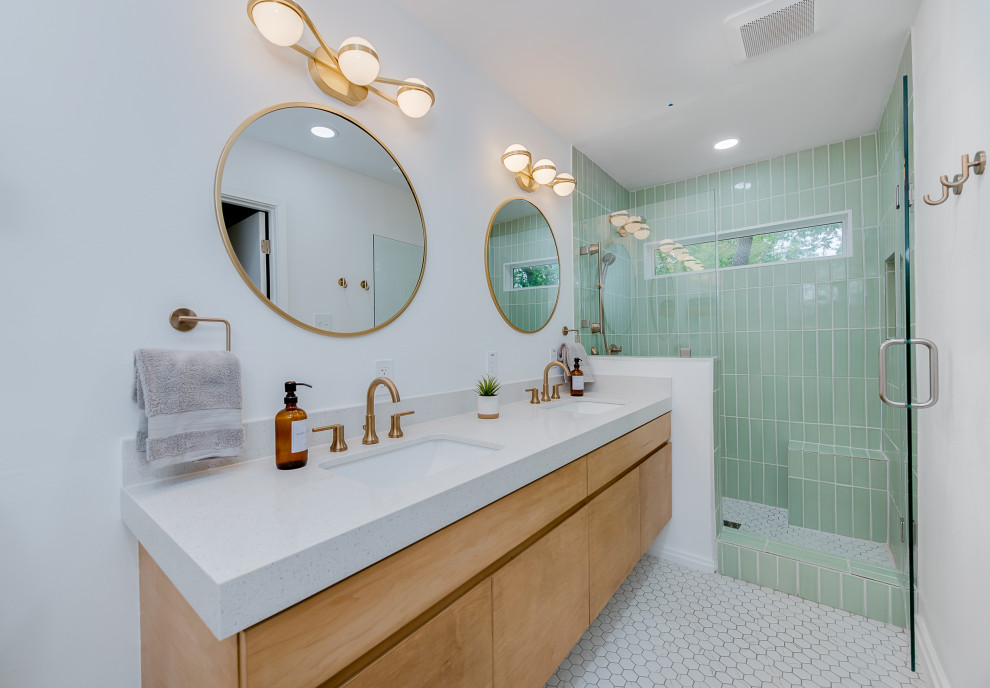 Midcentury master bathroom in Austin with flat-panel cabinets, light wood cabinets, a bidet, green tile, porcelain floors, an undermount sink, engineered quartz benchtops, white floor, white benchtops, a shower seat, a double vanity and a floating vanity.