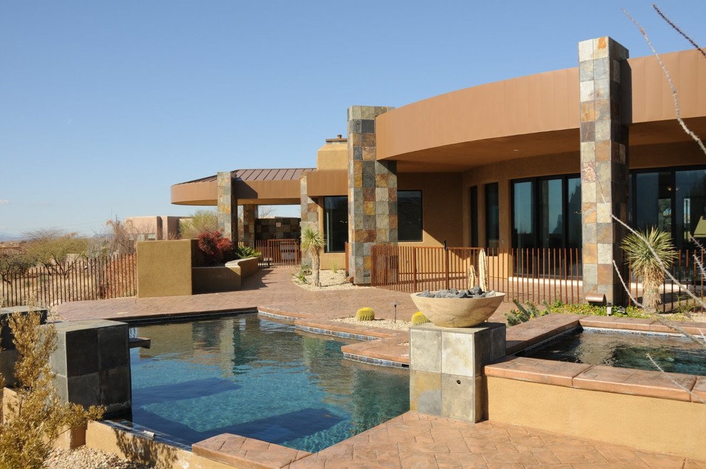 Photo of a contemporary one-storey brown exterior in Phoenix.