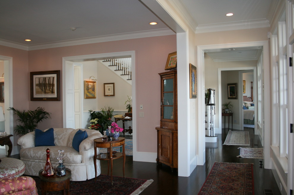 Mid-sized elegant dark wood floor hallway photo in Boston with pink walls