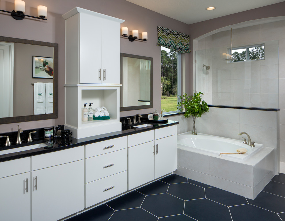 Design ideas for a transitional master bathroom in Jacksonville with flat-panel cabinets, white cabinets, a drop-in tub, purple walls, an undermount sink, blue floor and black benchtops.