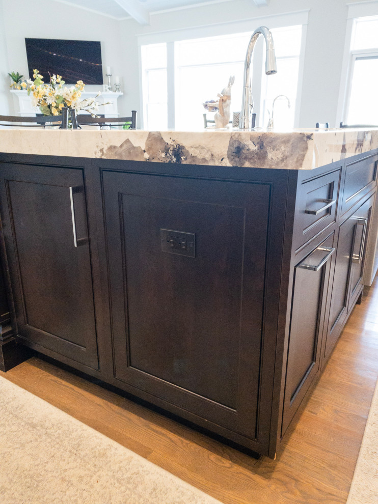 Example of a large transitional l-shaped medium tone wood floor, gray floor and shiplap ceiling eat-in kitchen design with an undermount sink, flat-panel cabinets, white cabinets, granite countertops, yellow backsplash, subway tile backsplash, stainless steel appliances, an island and white countertops