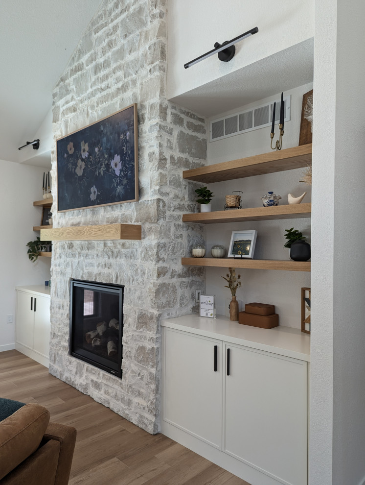 Inspiration for a large transitional l-shaped vinyl floor and brown floor eat-in kitchen remodel with a double-bowl sink, shaker cabinets, light wood cabinets, quartzite countertops, white backsplash, ceramic backsplash, stainless steel appliances, an island and white countertops