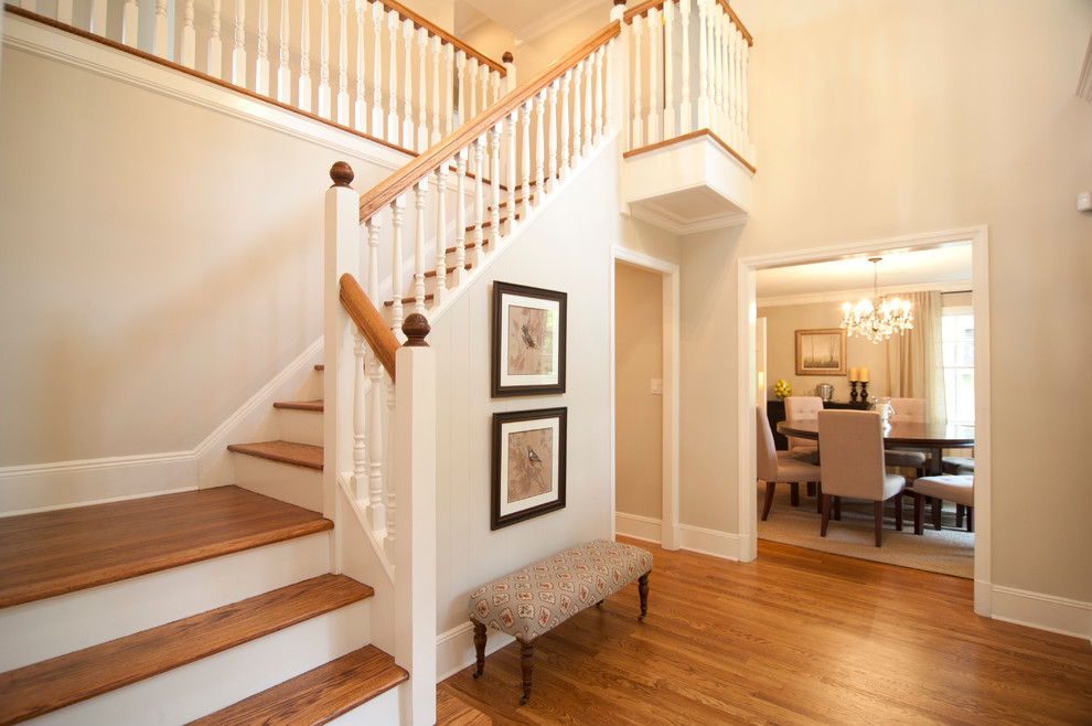 Example of a mid-sized transitional dark wood floor and brown floor front door design in New York with beige walls
