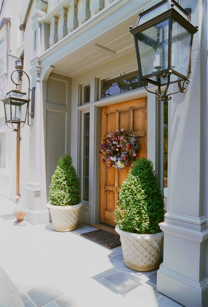 Photo of a traditional front door in San Francisco with a single front door and a medium wood front door.