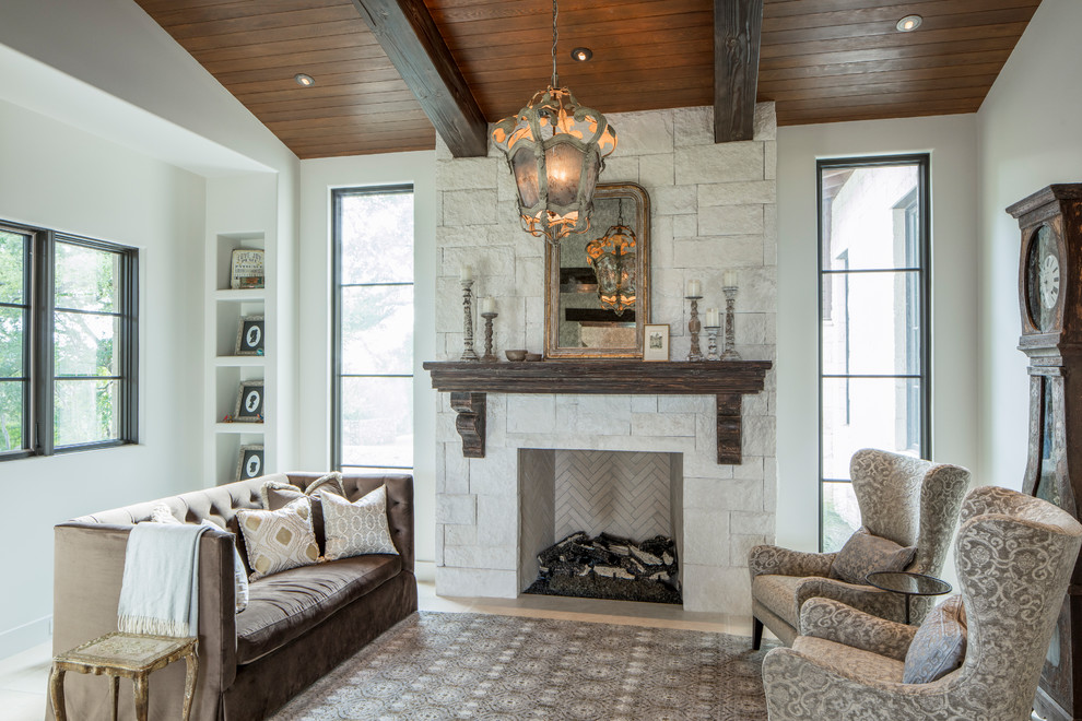 Photo of a country formal living room in Austin with white walls, a standard fireplace, a stone fireplace surround and no tv.
