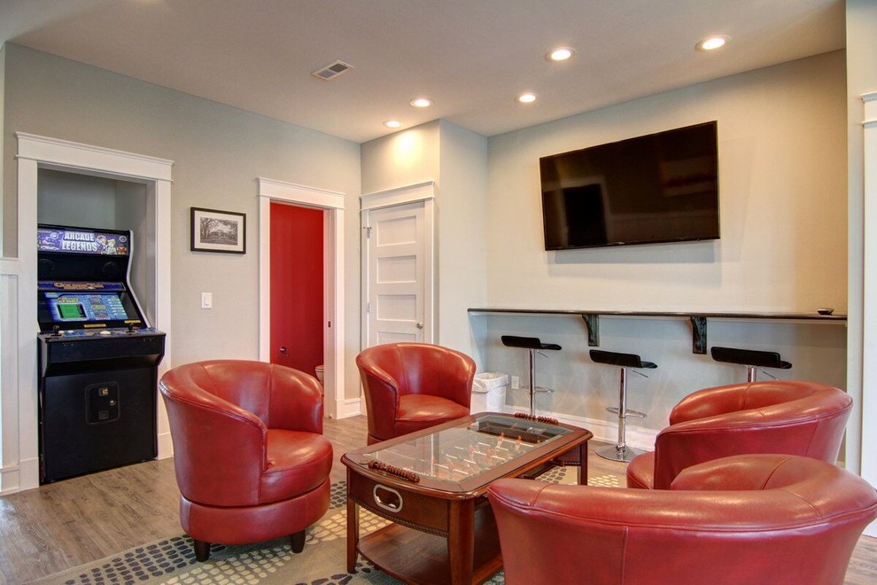 Photo of a mid-sized contemporary enclosed family room in Other with a game room, grey walls, vinyl floors, no fireplace and a wall-mounted tv.
