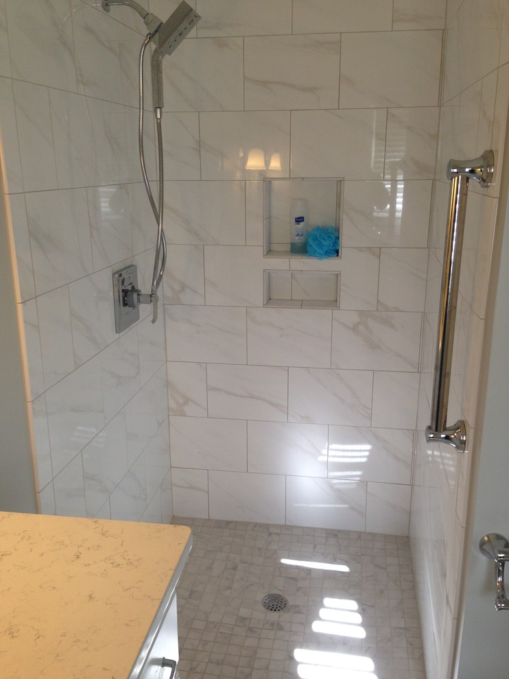 Inspiration for a small transitional master white tile and porcelain tile porcelain tile and white floor walk-in shower remodel in Atlanta with an undermount sink, recessed-panel cabinets, white cabinets, quartz countertops, gray walls and white countertops