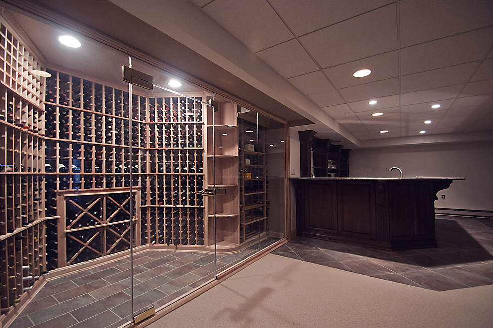 Mid-sized elegant ceramic tile wine cellar photo in Other with storage racks