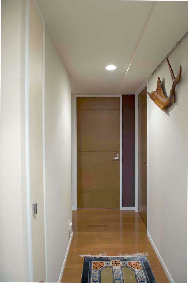 Inspiration for a small hallway in Tokyo Suburbs with red walls, ceramic flooring, a single front door, a white front door, white floors, a wallpapered ceiling and wallpapered walls.