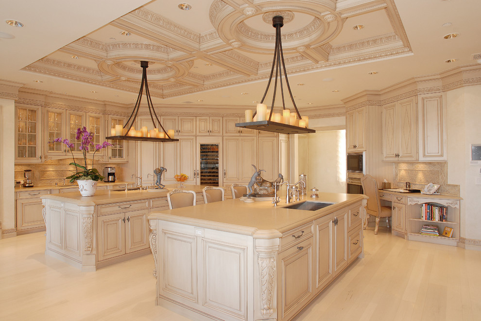 Inspiration for a traditional kitchen in Los Angeles with an undermount sink, raised-panel cabinets, beige cabinets, beige splashback and stainless steel appliances.