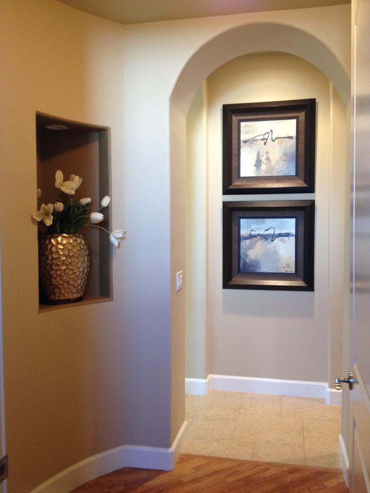 Example of a transitional home design design in Denver