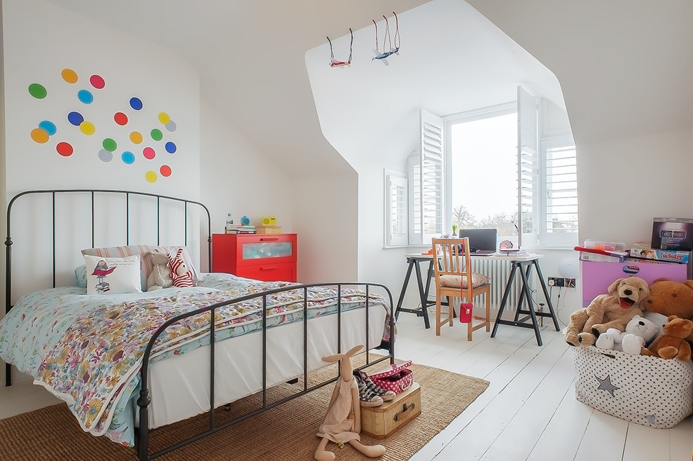 Contemporary kids' bedroom in London with white walls, painted wood floors and white floor for kids 4-10 years old and girls.