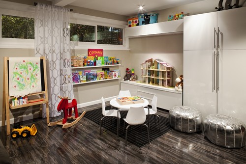 playroom with table, toys, and large storage cabinet