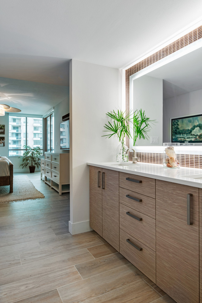 This is an example of a large master bathroom in Chicago with flat-panel cabinets, light wood cabinets, white tile, marble, engineered quartz benchtops, beige floor, a single vanity and a built-in vanity.