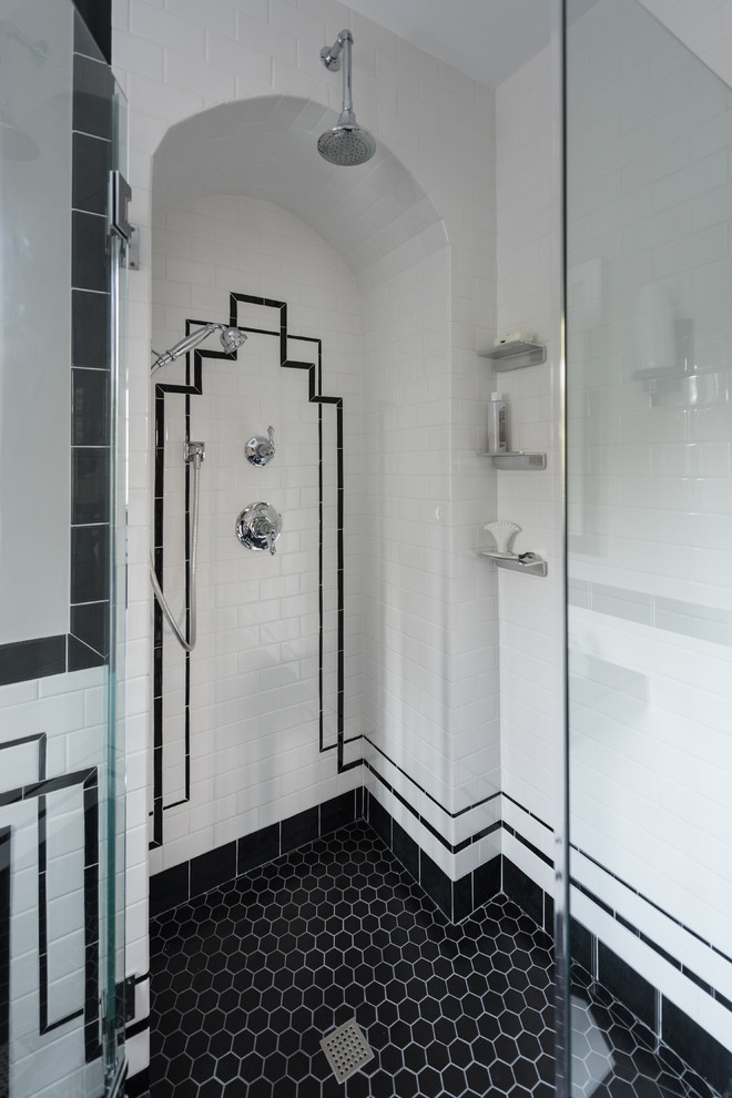Design ideas for a large transitional master bathroom in Providence with open cabinets, a freestanding tub, a corner shower, a two-piece toilet, black and white tile, ceramic tile, grey walls, porcelain floors, a console sink, black floor, a hinged shower door and black benchtops.