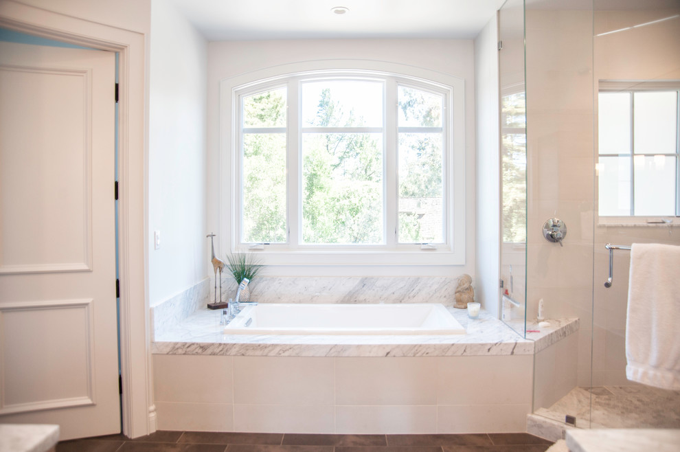 Inspiration for a large contemporary master bathroom in San Francisco with a drop-in tub, a corner shower, a two-piece toilet, white walls and ceramic floors.
