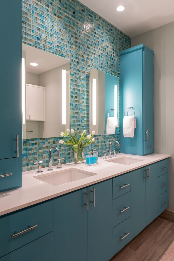 Design ideas for a mid-sized beach style master bathroom in Houston with flat-panel cabinets, an alcove shower, blue tile, glass tile, grey walls, limestone floors, an undermount sink and quartzite benchtops.