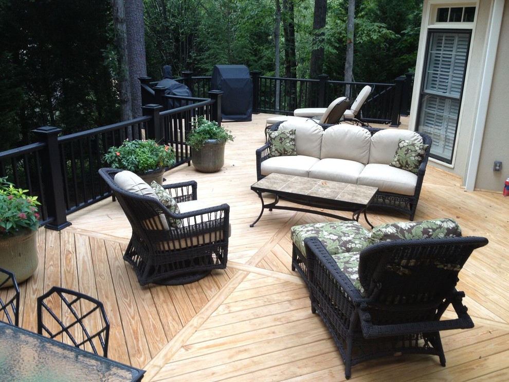 Photo of a mid-sized contemporary backyard deck in Atlanta with no cover.