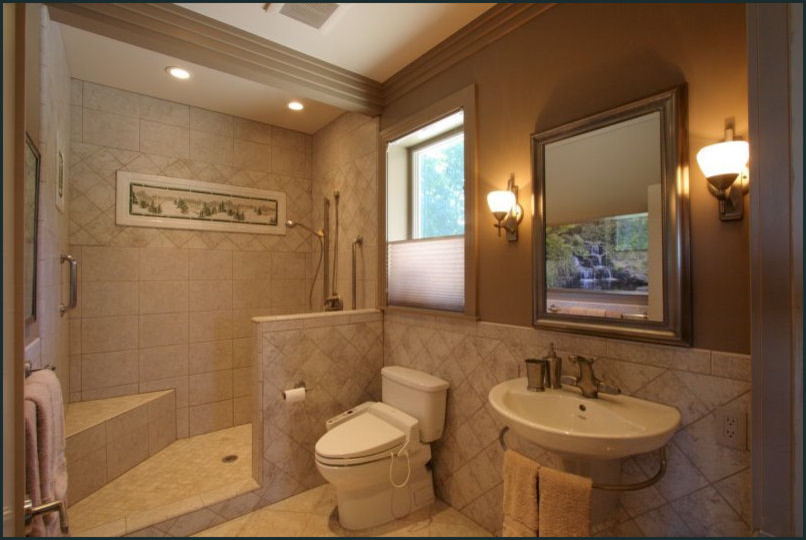 Design ideas for a mid-sized modern bathroom in Portland with a wall-mount sink, an alcove shower, a two-piece toilet, beige tile, porcelain tile, beige walls and porcelain floors.