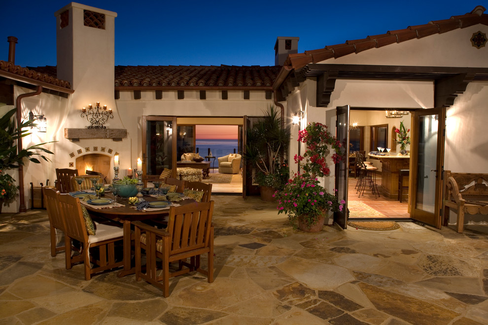 Mediterranean patio in Orange County with a fire feature.