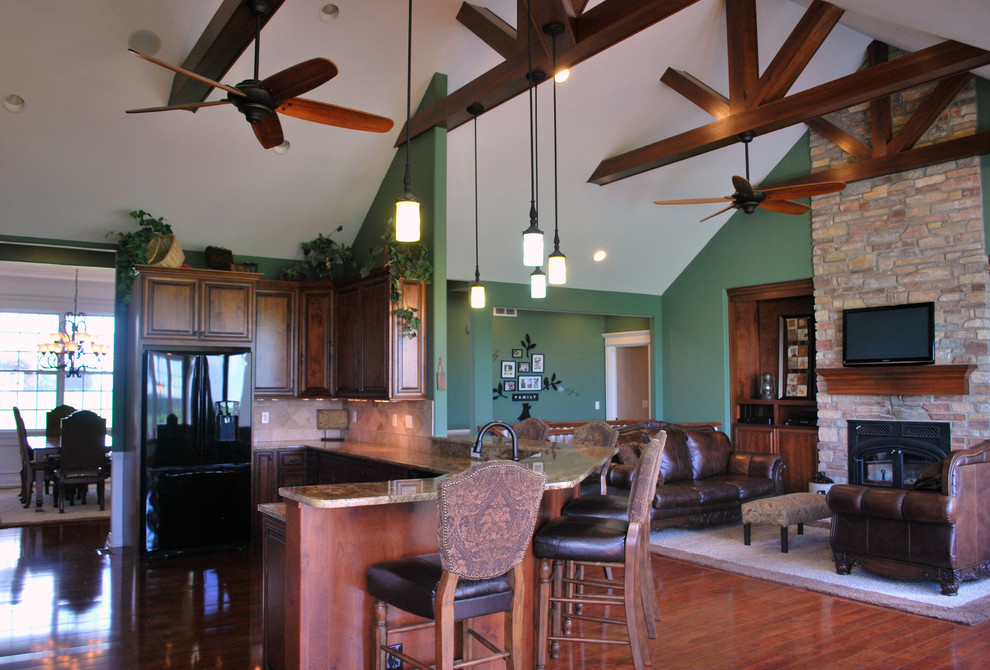 Eat-in kitchen - transitional u-shaped dark wood floor eat-in kitchen idea in Chicago with recessed-panel cabinets, medium tone wood cabinets, granite countertops, beige backsplash, stainless steel appliances and an island