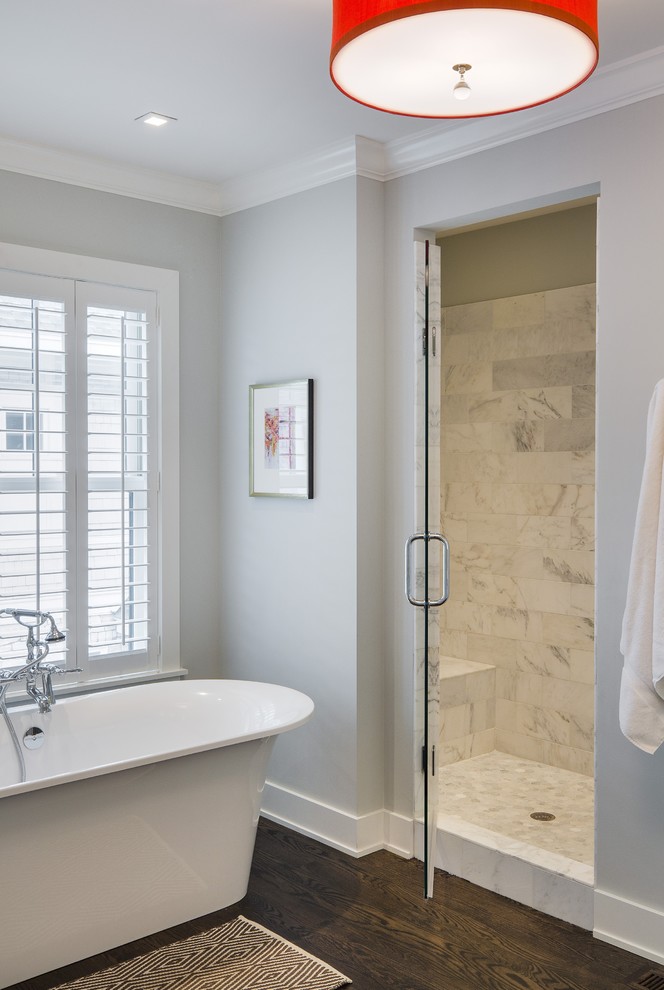 Inspiration for a transitional bathroom in Minneapolis with a freestanding tub, an alcove shower, white tile, grey walls and dark hardwood floors.