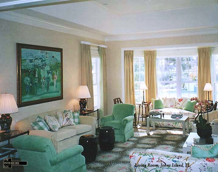 Large eclectic living room in New York with beige walls, a stone fireplace surround and travertine floors.